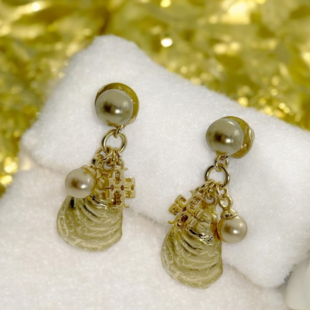 Tory Burch Shell Charms Earrings in gold.